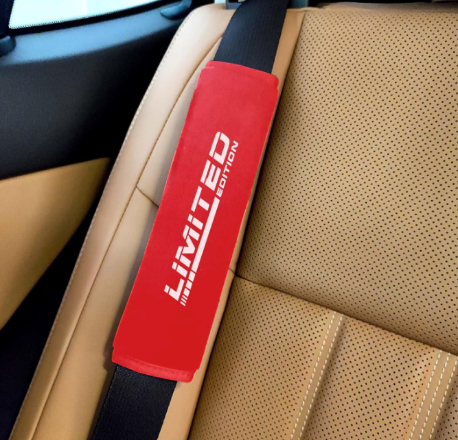Generic black car seat belt shoulder pad featuring secure full length velcro attachment and lightweight breathable fabric