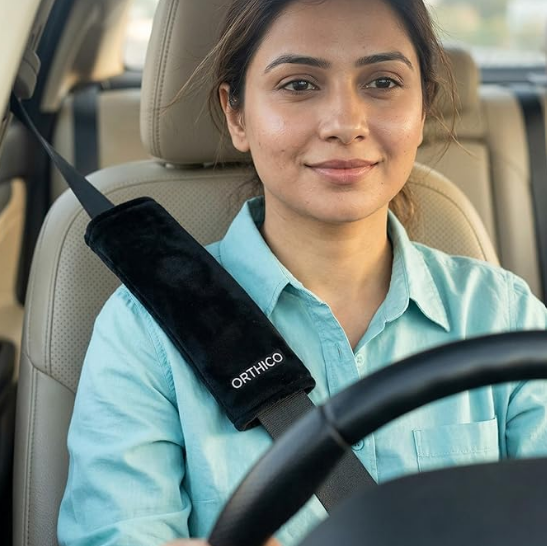 Generic black car seat belt cushion pack showing a slim modern twelve inch profile and breathable mesh fabric for shoulder comfort