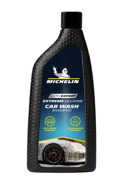 MICHELIN Car Shampoo 500ml bottle illustrating wax free citrus formula for high foaming action on a car exterior.