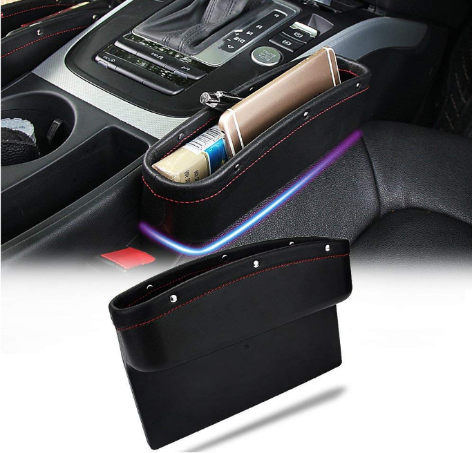 Structured faux leather car seat crevice organizer box featuring a deep storage caddy compartment for keys and loose coins, mounted tightly next to a vehicle's gear shifter console.