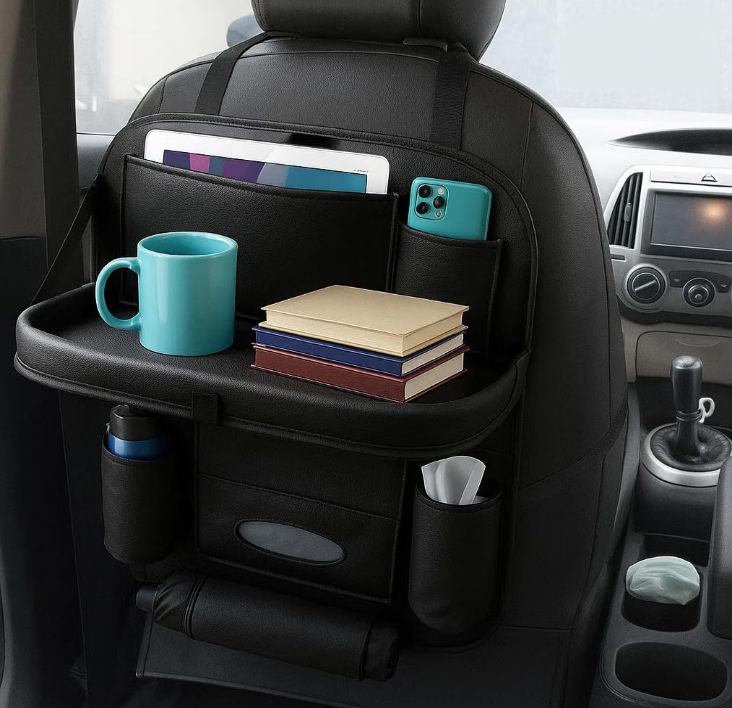 TSKN black faux leather backseat organizer with extended foldable tray table attached to front car seatback